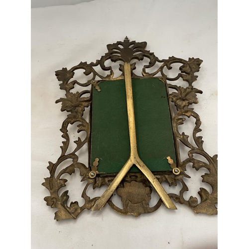 189 - A BRASS PHOTO FRAME IN A ROCOCO STYLE HEIGHT 30CM