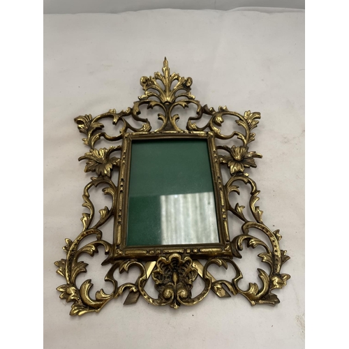 189 - A BRASS PHOTO FRAME IN A ROCOCO STYLE HEIGHT 30CM