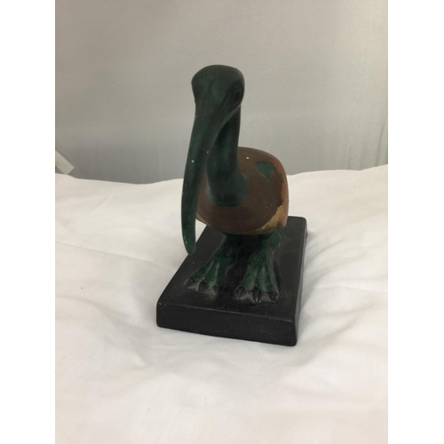 207 - A CERAMIC PREHISTORIC LOOKING BIRD ON A BASE HEIGHT 20CM, LENGTH 21CM