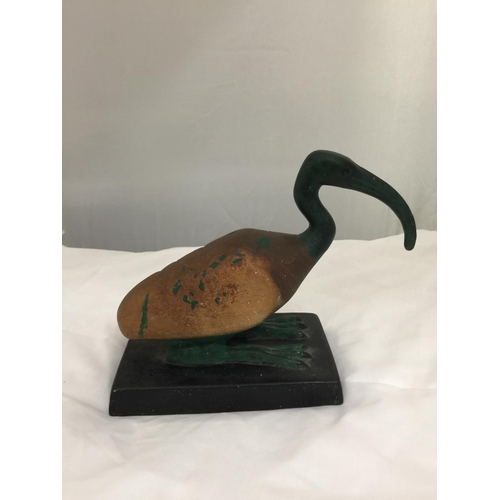 207 - A CERAMIC PREHISTORIC LOOKING BIRD ON A BASE HEIGHT 20CM, LENGTH 21CM