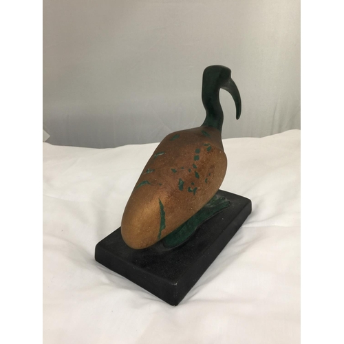 207 - A CERAMIC PREHISTORIC LOOKING BIRD ON A BASE HEIGHT 20CM, LENGTH 21CM