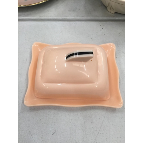 225 - A PINK ART DECO STYLE POSSIBLY BAKELITE BUTTER DISH