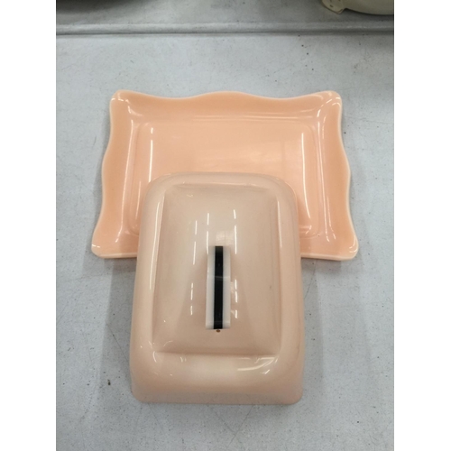 225 - A PINK ART DECO STYLE POSSIBLY BAKELITE BUTTER DISH