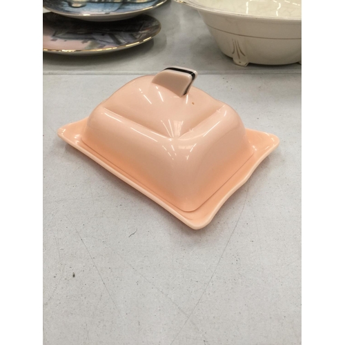 225 - A PINK ART DECO STYLE POSSIBLY BAKELITE BUTTER DISH