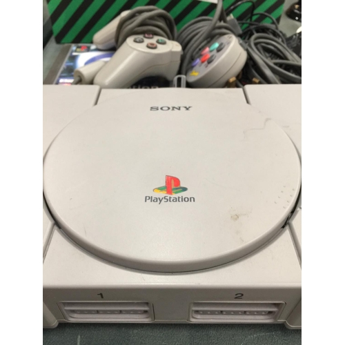 230 - A SONY PLAYSTATION 1 WITH CONTROLLERS AND GAME