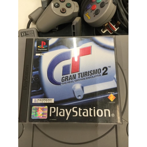 230 - A SONY PLAYSTATION 1 WITH CONTROLLERS AND GAME