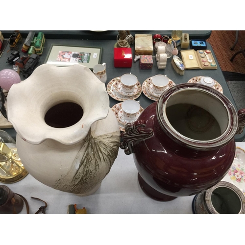 241 - TWO LARGE VASES, ONE STONE EFFECT WITH FLUTED TOP H: 50CM W:30 CM  , ONE BURGUNDY GLAZED WITH DECORA... 