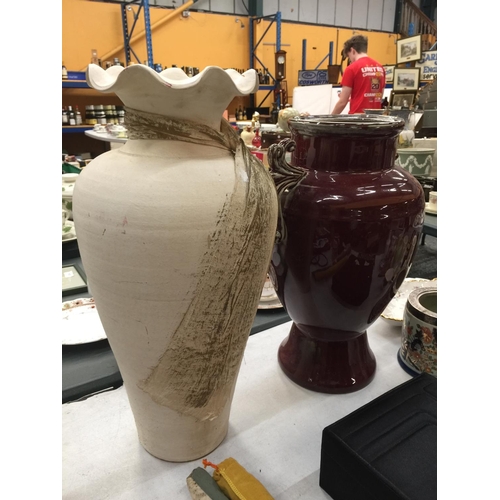 241 - TWO LARGE VASES, ONE STONE EFFECT WITH FLUTED TOP H: 50CM W:30 CM  , ONE BURGUNDY GLAZED WITH DECORA... 