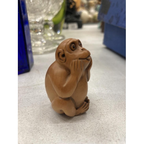 248 - A WOODEN CARVED NETSUKE MONKEY