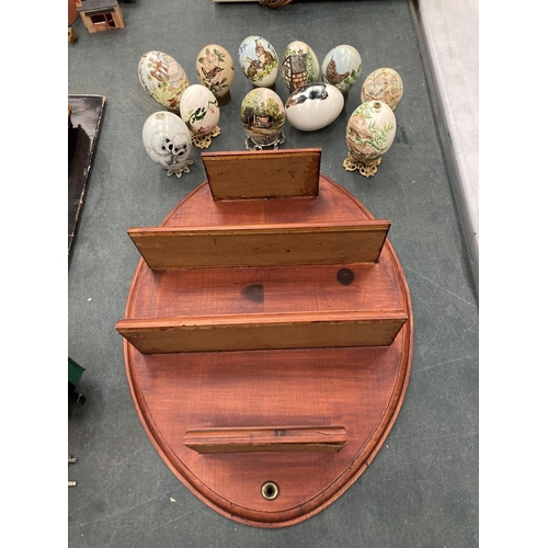 255 - A WOODEN DISPLAY SHELF WITH A QUANTITY OF PAINTED EGGS