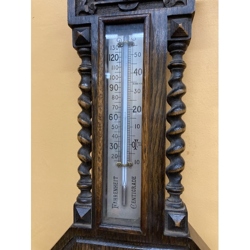 285 - A MAHOGANY/OAK CASED BAROMETER HEIGHT APPROX 57CM