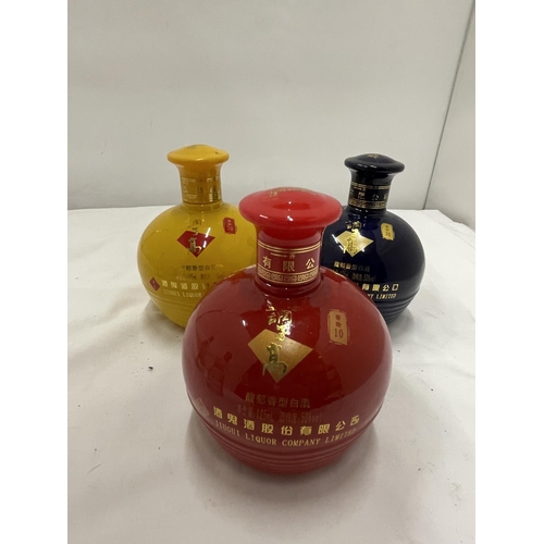 311 - SIX VARIOUS BOTTLES OF CHINESE SPIRIT THREE IN COLOURFUL CERAMIC BOTTLES WITH FLORAL DECORATION