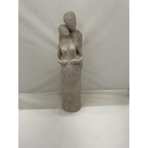 452 - A STONEWARE FIGURINE OF A MAN HOLDING A PREGNANT LADY HEIGHT 38CM