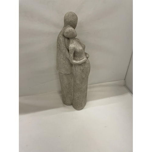 452 - A STONEWARE FIGURINE OF A MAN HOLDING A PREGNANT LADY HEIGHT 38CM