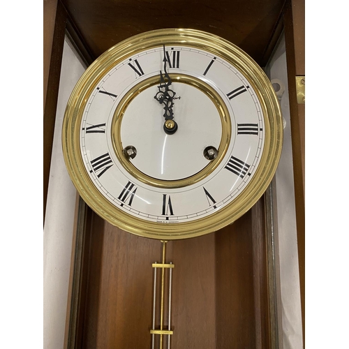 45A - A MAHOGANY CASED WALL CLOCK