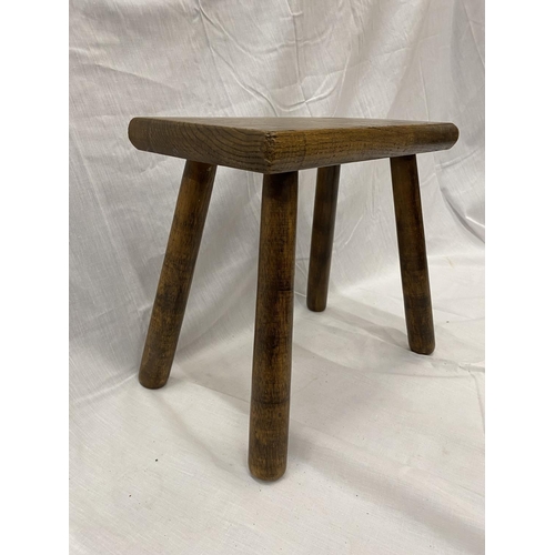 46 - A VINTAGE OAK RECTANGULAR FOUR LEGGED STOOL