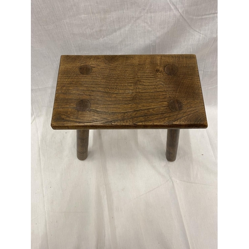 46 - A VINTAGE OAK RECTANGULAR FOUR LEGGED STOOL