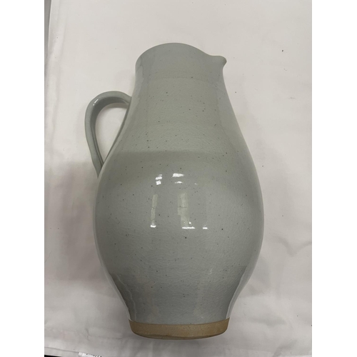 460 - A LARGE VASE IN GREEN AND CREAM HEIGHT 47CM AND A LARGE STUDIO POTTERY JUG HEIGHT 35CM