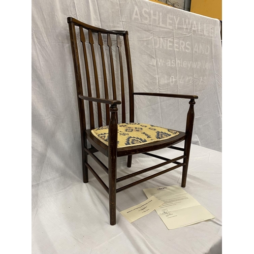 47 - AN EARLY 20TH CENTURY LIBERTY BIRMINGHAM BEECH NURSING CHAIR WITH TURNED LEGS AND STRETCHERS, ARROW ... 