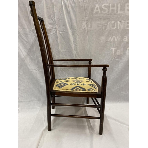 47 - AN EARLY 20TH CENTURY LIBERTY BIRMINGHAM BEECH NURSING CHAIR WITH TURNED LEGS AND STRETCHERS, ARROW ... 