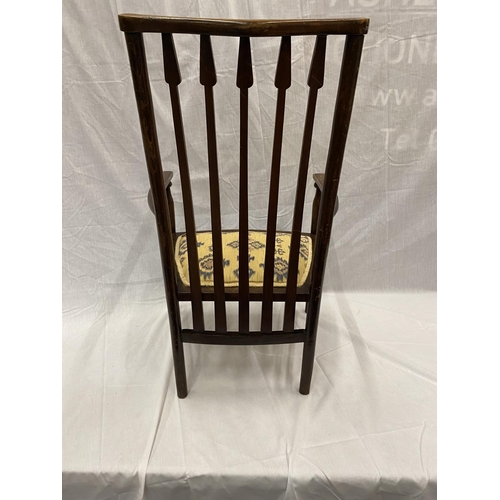 47 - AN EARLY 20TH CENTURY LIBERTY BIRMINGHAM BEECH NURSING CHAIR WITH TURNED LEGS AND STRETCHERS, ARROW ... 