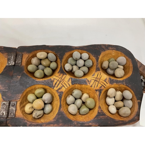 473 - TWO VINTAGE AFRICAN HAND CARVED WOODEN MANCALA GAME COMPLETE WITH SEEDS