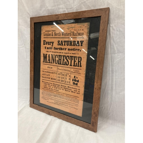 48 - A FRAMED LONDON AND NORTH WESTERN RAILWAY POSTER ADVERTISING CHEAP TICKETS TO MANCHESTER