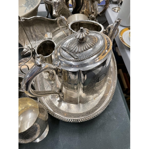 486 - A QUANTITY OF SILVER PLATED ITEMS TO INCLUDE TEA AND COFFEE POTS, GOBLET, A STAG DISH, GALLERIED TRA... 