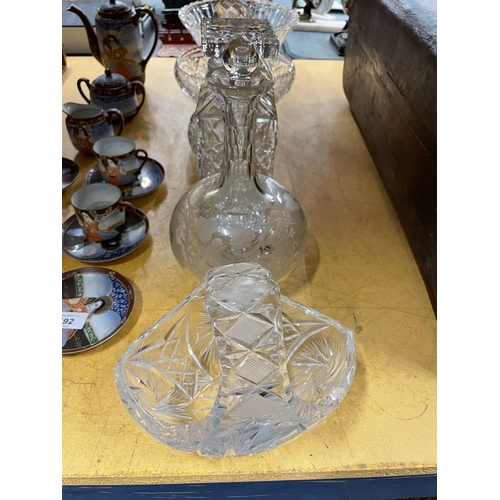 491 - A QUANTITY OF LEAD CUT CRYSTAL GLASS TO INCLUDE DECANTERS, BOWLS AND A BASKET