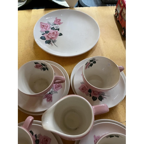 495 - A QUANTITY OF WADE PINK AND FLORAL TEAWARE TO INCLUDE TRIOS, CREAM JUG, SUGAR BOWL, AND SANDWICH PLA... 