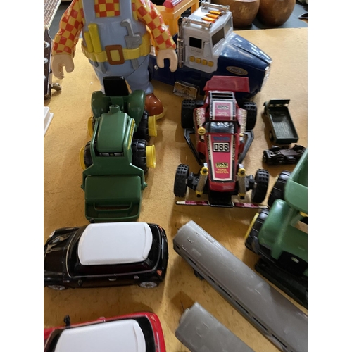 497 - A QUANTITY OF TOYS TO INCLUDE TRAIN CARRIAGES, BOB THE BUILDER DOLL, MINI CARS, DIGGERS, TONKA TRUCK... 