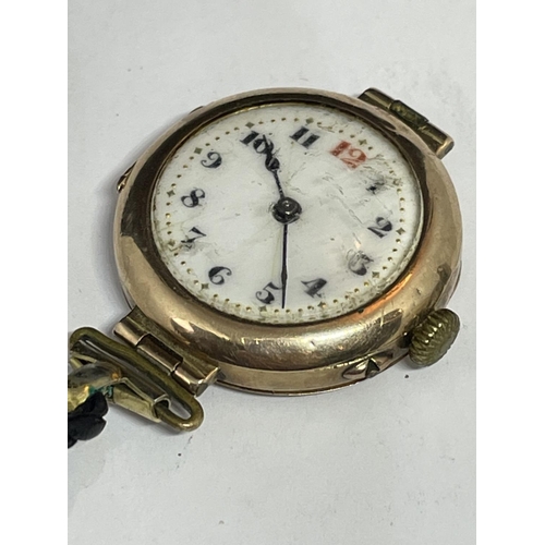 503 - A MARKED 9 CARAT GOLD CASED WATCH WITH LEATHER STRAP IN NEED OF REPAIR