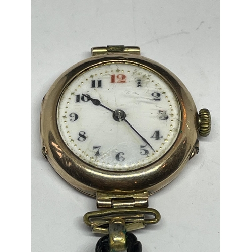 503 - A MARKED 9 CARAT GOLD CASED WATCH WITH LEATHER STRAP IN NEED OF REPAIR