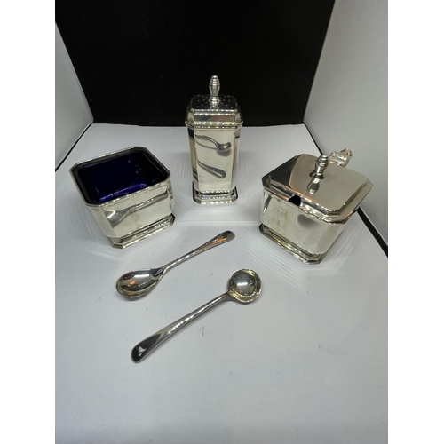 505 - A HALLMARKED BIRMINGHAM SILVER DECO STYLE CRUET SET WITH BLUE GLASS LINER IN A PRESENTATION CASE. GR... 