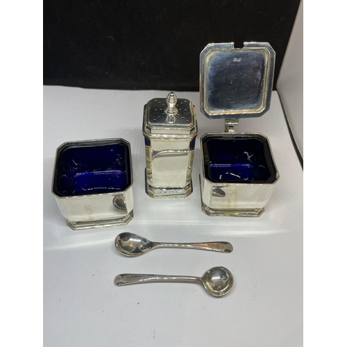 505 - A HALLMARKED BIRMINGHAM SILVER DECO STYLE CRUET SET WITH BLUE GLASS LINER IN A PRESENTATION CASE. GR... 