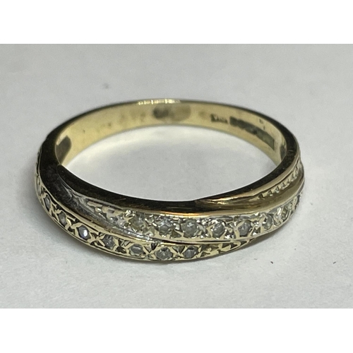 507 - A 9 CARAT GOLD RING WITH DIAMONDS IN A CROSSOVER DESIGN SIZE L/M