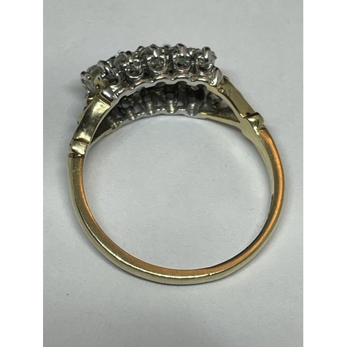 513 - A 9 CARAT GOLD RING WITH FIFTEEN CUBIC ZIRCONIA STONES IN A CLUSTER DESIGN SIZE N