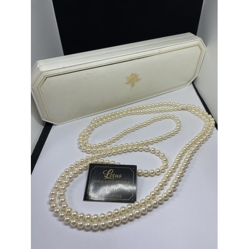 537 - A LONG STRAND OF LOTUS PEARLS IN A PRESENTATION BOX