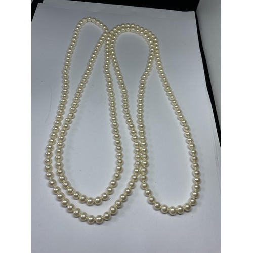 537 - A LONG STRAND OF LOTUS PEARLS IN A PRESENTATION BOX