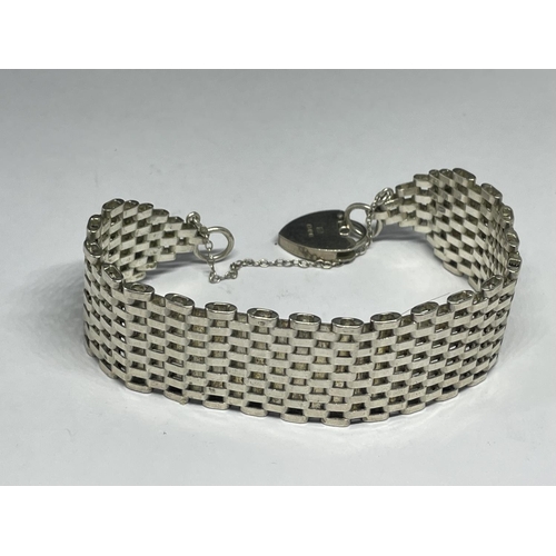 542 - A MARKED SILVER GATE BRACELET