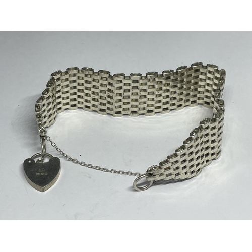 542 - A MARKED SILVER GATE BRACELET