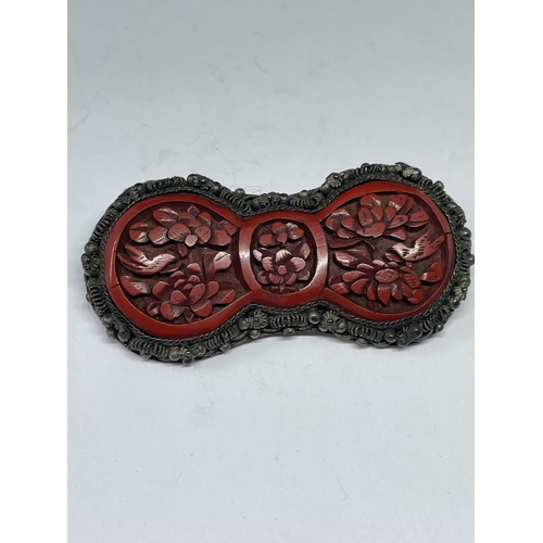 553 - AN ORIENTAL CORAL BROOCH IN A PRESENTATION BOX