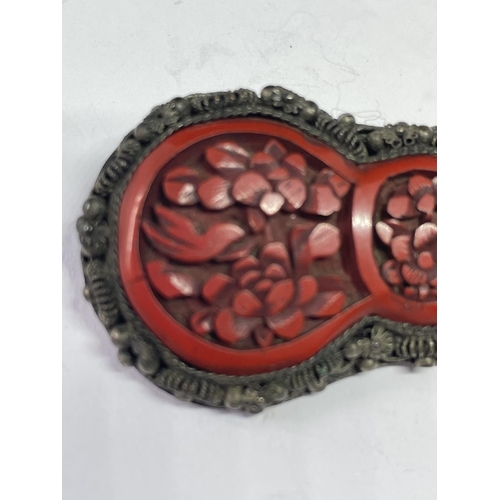 553 - AN ORIENTAL CORAL BROOCH IN A PRESENTATION BOX