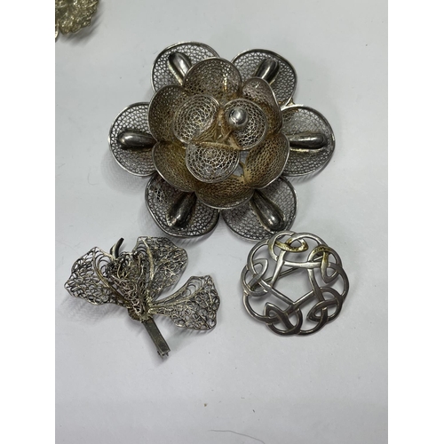 555 - FIVE DECORATIVE SILVER BROOCHES