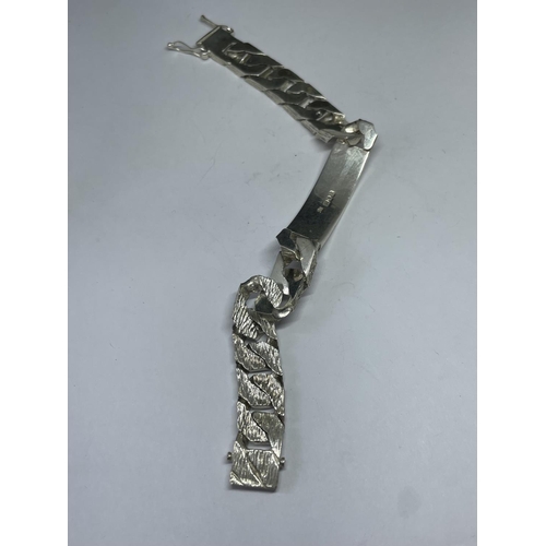 561 - A HEAVY HALLMARKED LONDON SILVER IDENTITY BRACELET