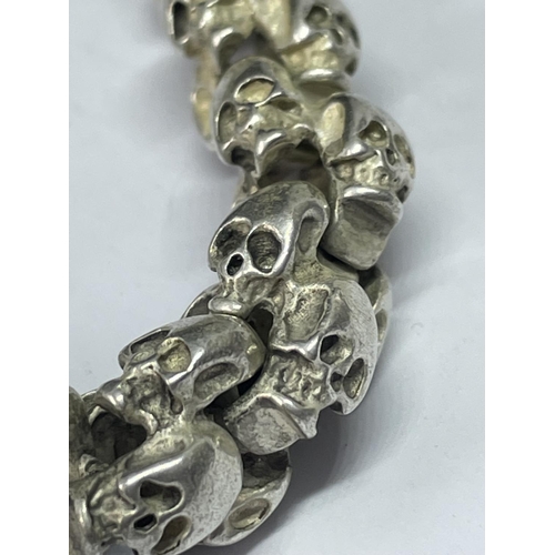 566 - A WHITE METAL SKULL BRACELET