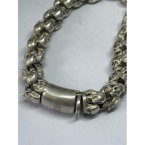 566 - A WHITE METAL SKULL BRACELET