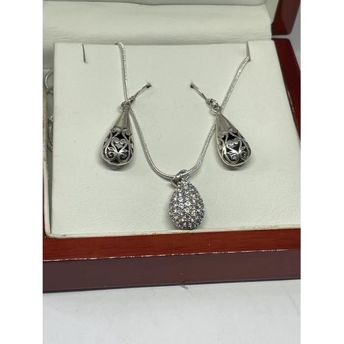 567 - A PAIR OF SILVER EARRINGS AND A SILVER PENDANT IN A PRESENTATION BOX