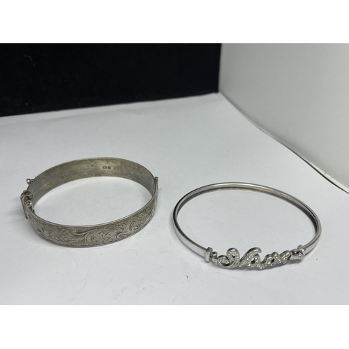 570 - TWO MARKED SILVER BANGLES ONE WITH MUM