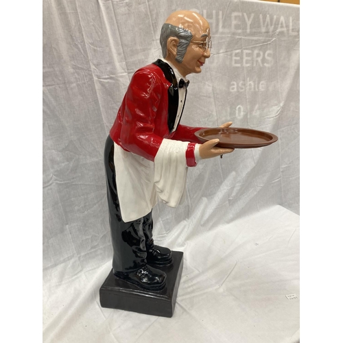 59A - A DUMB WAITER DEPICTING A BUTLER IN A RED JACKET WITH A TRAY HEIGHT 96CM